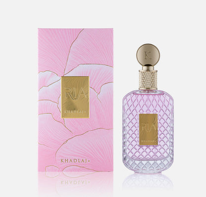 Khadlaj Ria Eau de Parfum 100ml bottle beside its pink marbled gift box with gold foil detailing